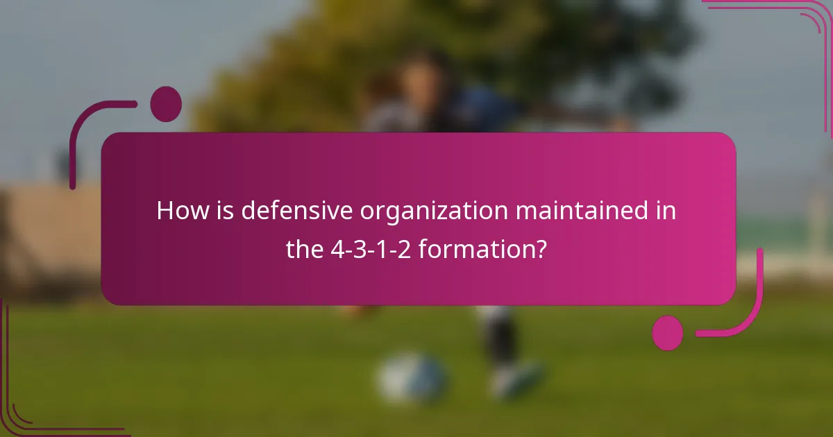 How is defensive organization maintained in the 4-3-1-2 formation?